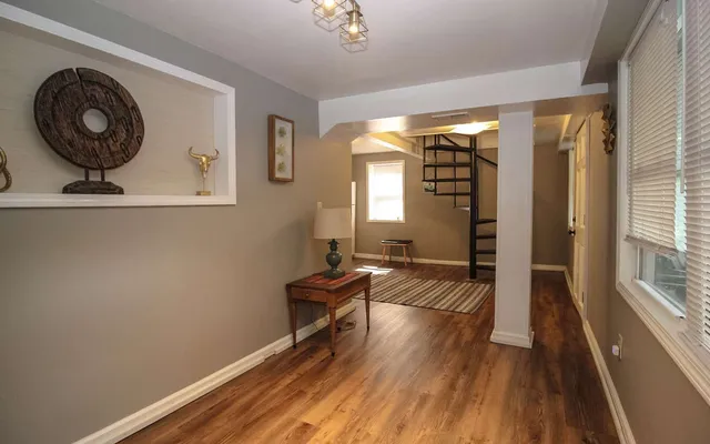 a view of a livingroom with furniture and wooden floor