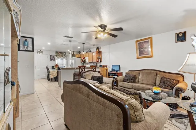 a living room with furniture and a rug