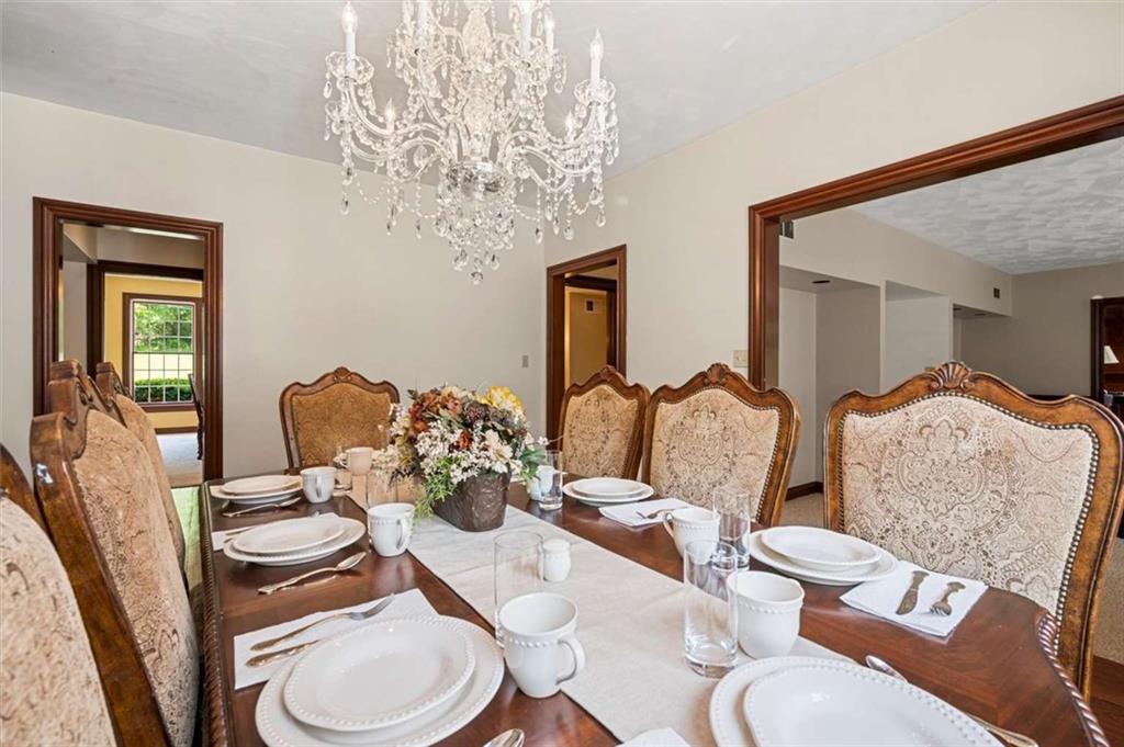 1702 Coulter Road Apollo, PA 15613 - Photo 14 of 50 a dining room with furniture a chandelier and wooden floor
