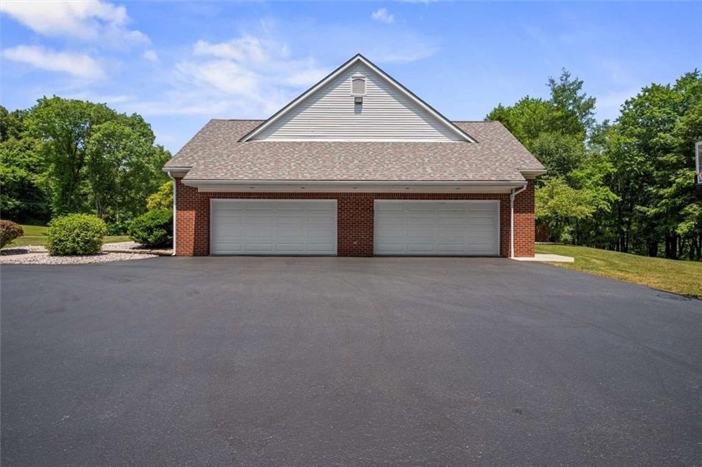 1702 Coulter Road Apollo, PA 15613 - Photo 28 of 50 a front view of a house with a yard and garage