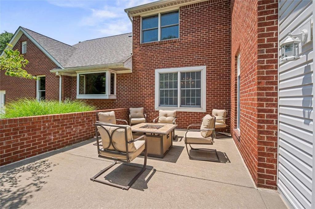 1702 Coulter Road Apollo, PA 15613 - Photo 30 of 50 a view of a patio with a table and chairs