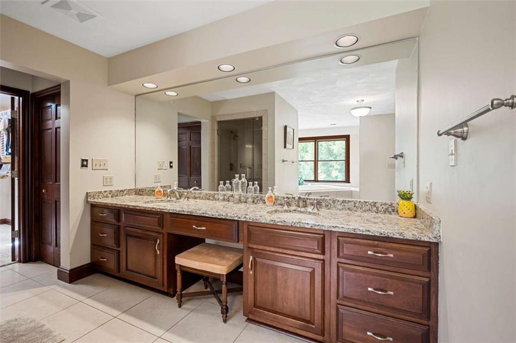 1702 Coulter Road Apollo, PA 15613 - Photo 10 of 50 a bathroom with a granite countertop sink and a mirror