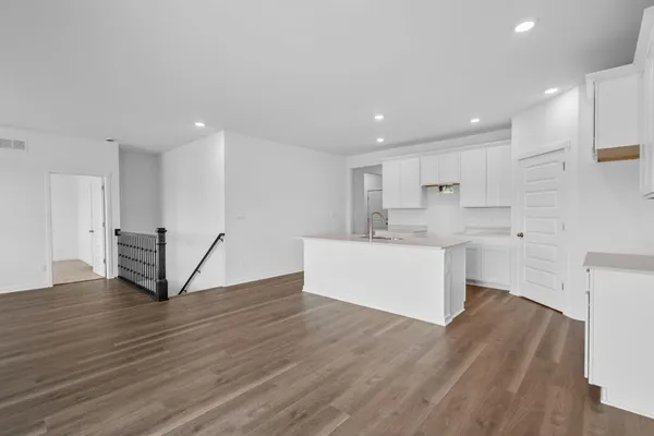 a view of kitchen with wooden floor
