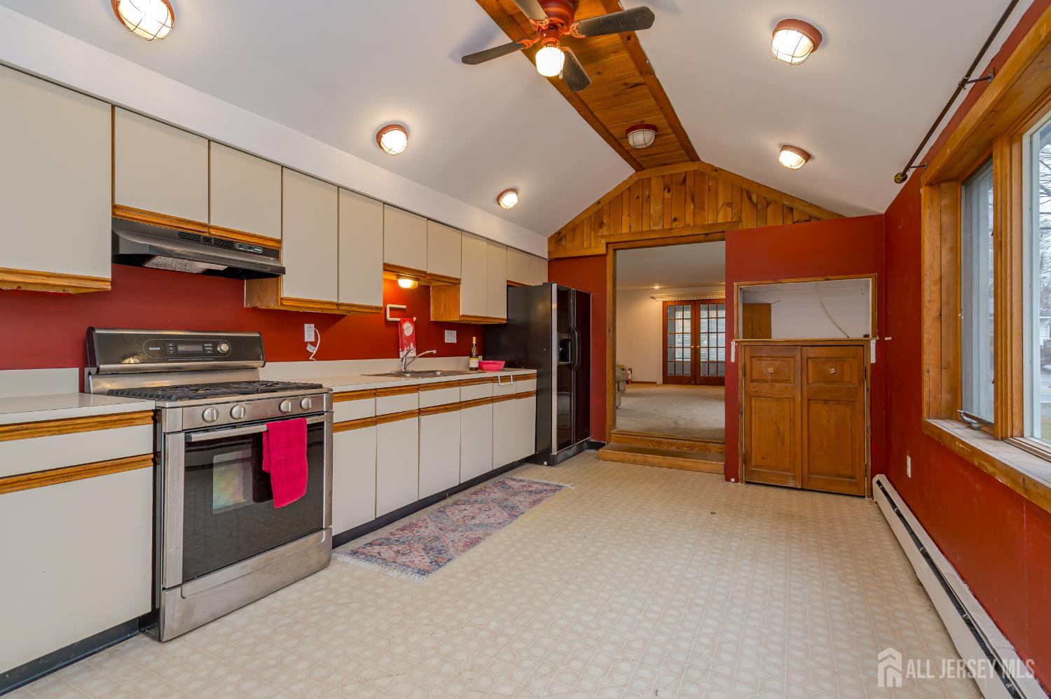 205 Main Street Spotswood, NJ 08884 - Photo 11 of 22 a kitchen with stainless steel appliances granite countertop a stove and a refrigerator