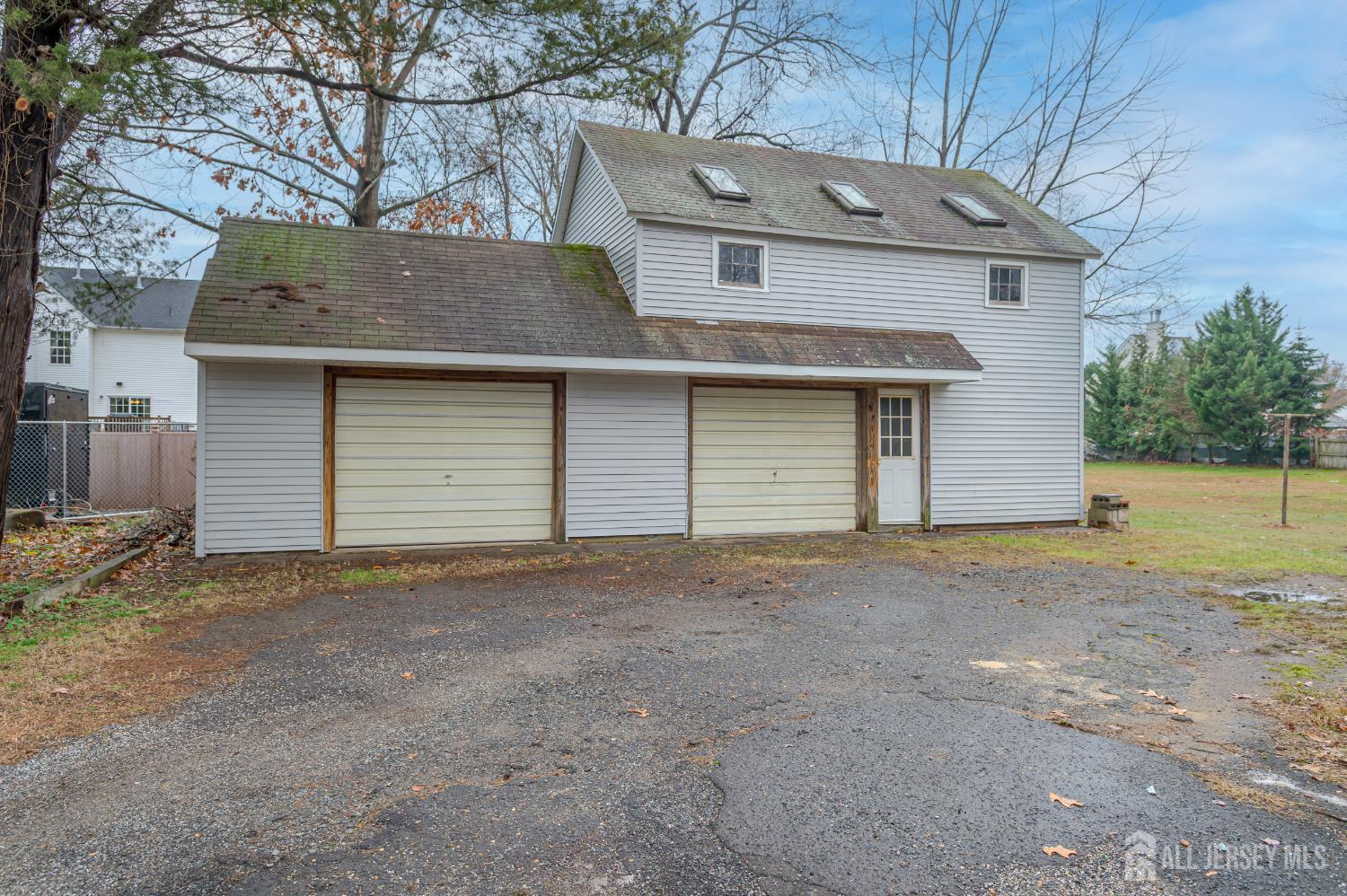 205 Main Street Spotswood, NJ 08884 - Photo 2 of 22 a front view of a house with a yard and garage