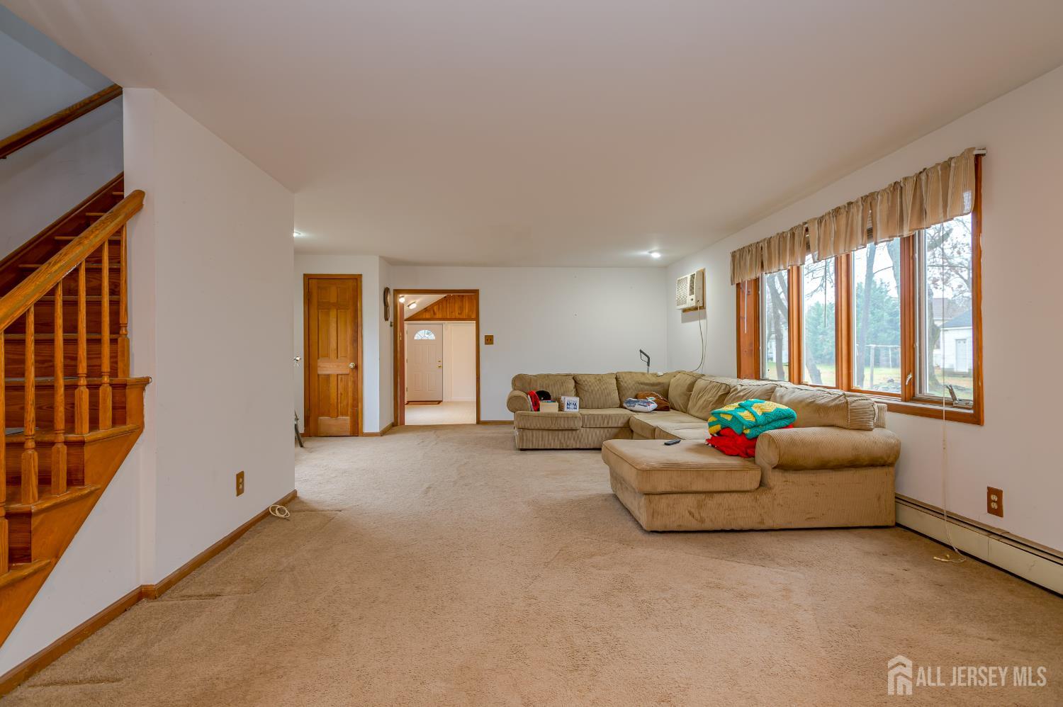 205 Main Street Spotswood, NJ 08884 - Photo 7 of 22 a living room with furniture and a window