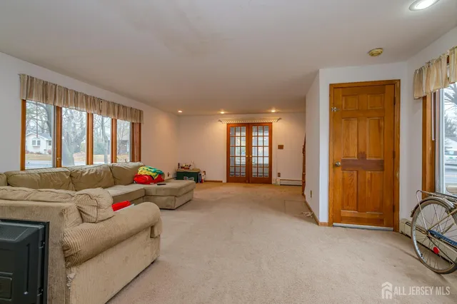 a living room with furniture and a window