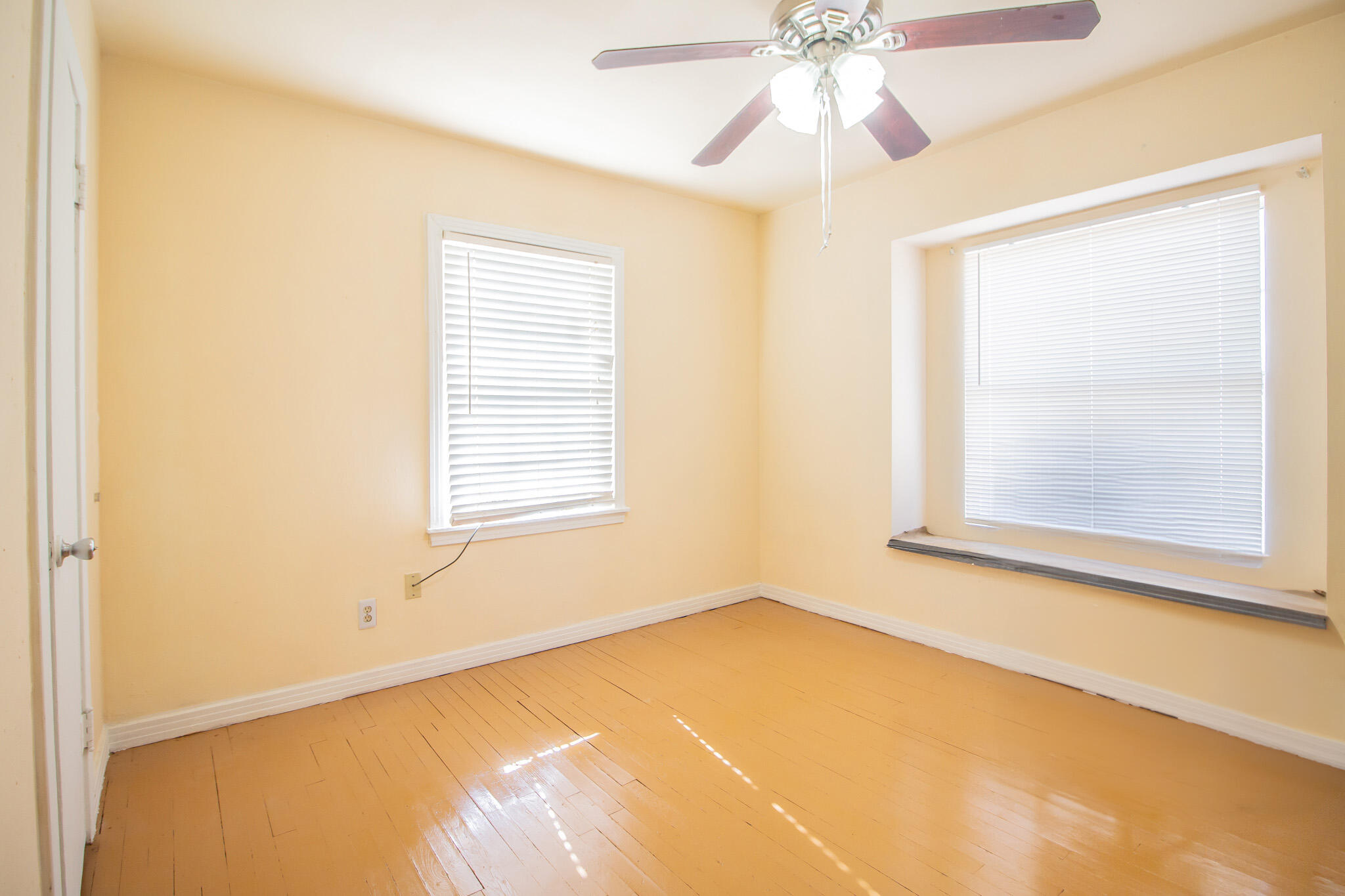 3216 Grinnell Street Lubbock, TX 79415 - Photo 3 of 9 a view of an empty room with a window