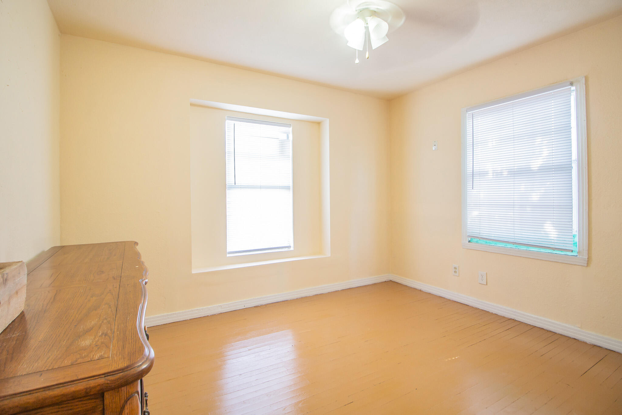 3216 Grinnell Street Lubbock, TX 79415 - Photo 4 of 9 a view of an empty room with a window