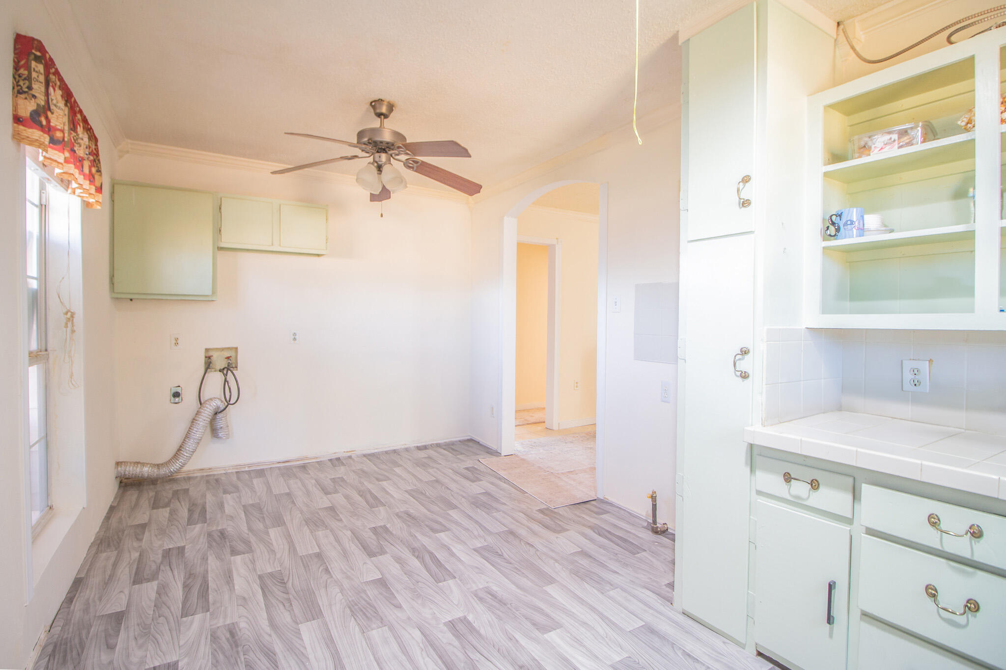 3216 Grinnell Street Lubbock, TX 79415 - Photo 9 of 9 a bathroom with a sink and a mirror
