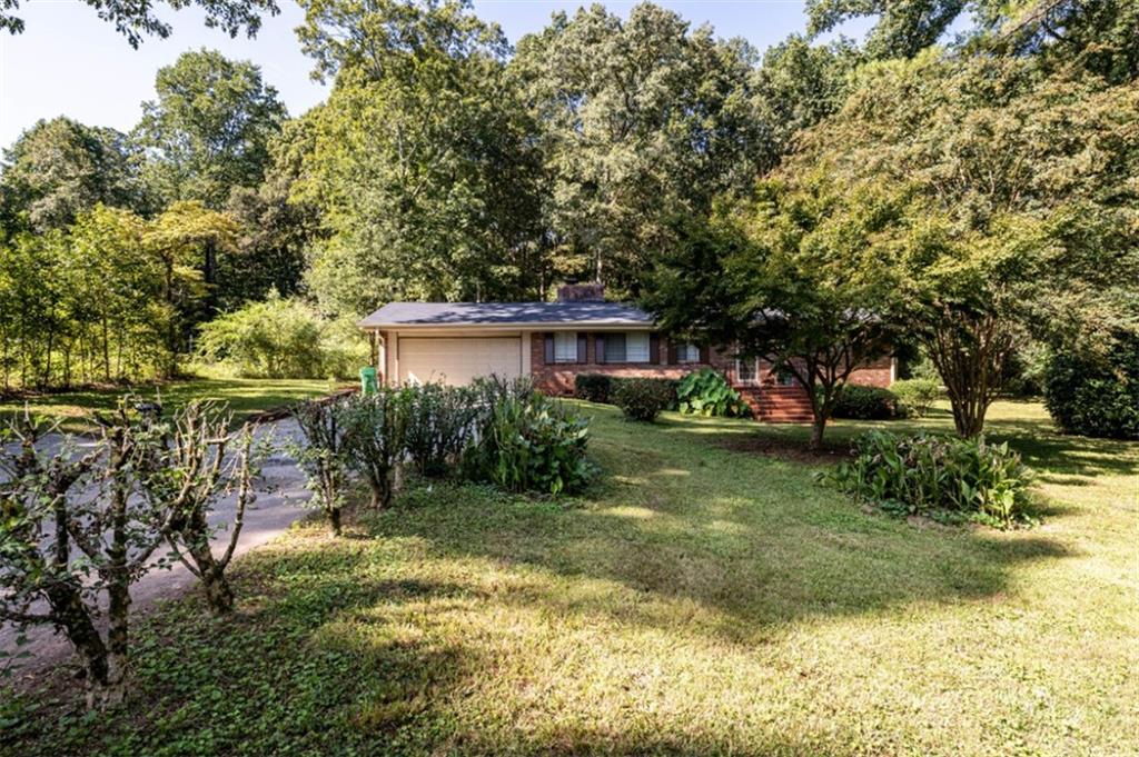 933 Ellis Road Stone Mountain, GA 30083 - Photo 1 of 1 a view of backyard of house with green space