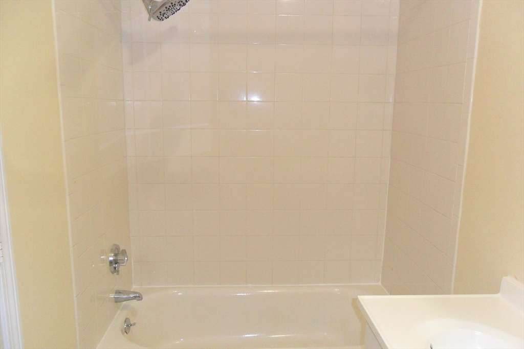 848 Waverly Street, Unit 4 Framingham, MA 01702 - Photo 11 of 13 a bathroom with a shower