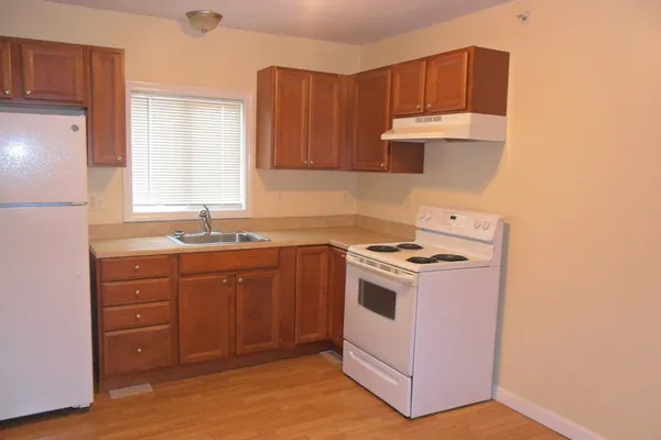 a kitchen with a stove and a sink