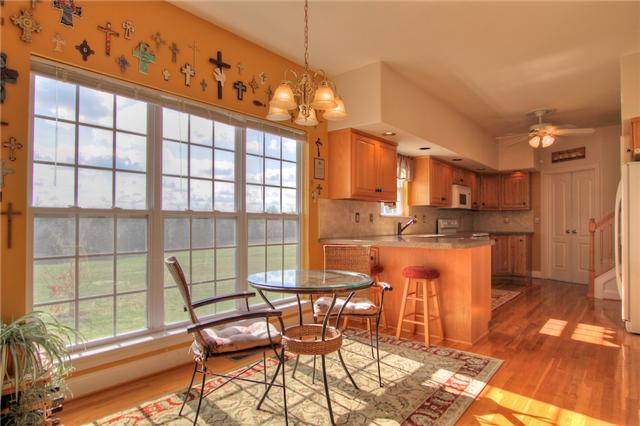 220 Ridgewater Way Mount Juliet, TN 37122 - Photo 17 of 18 a dining room with furniture and a floor to ceiling window