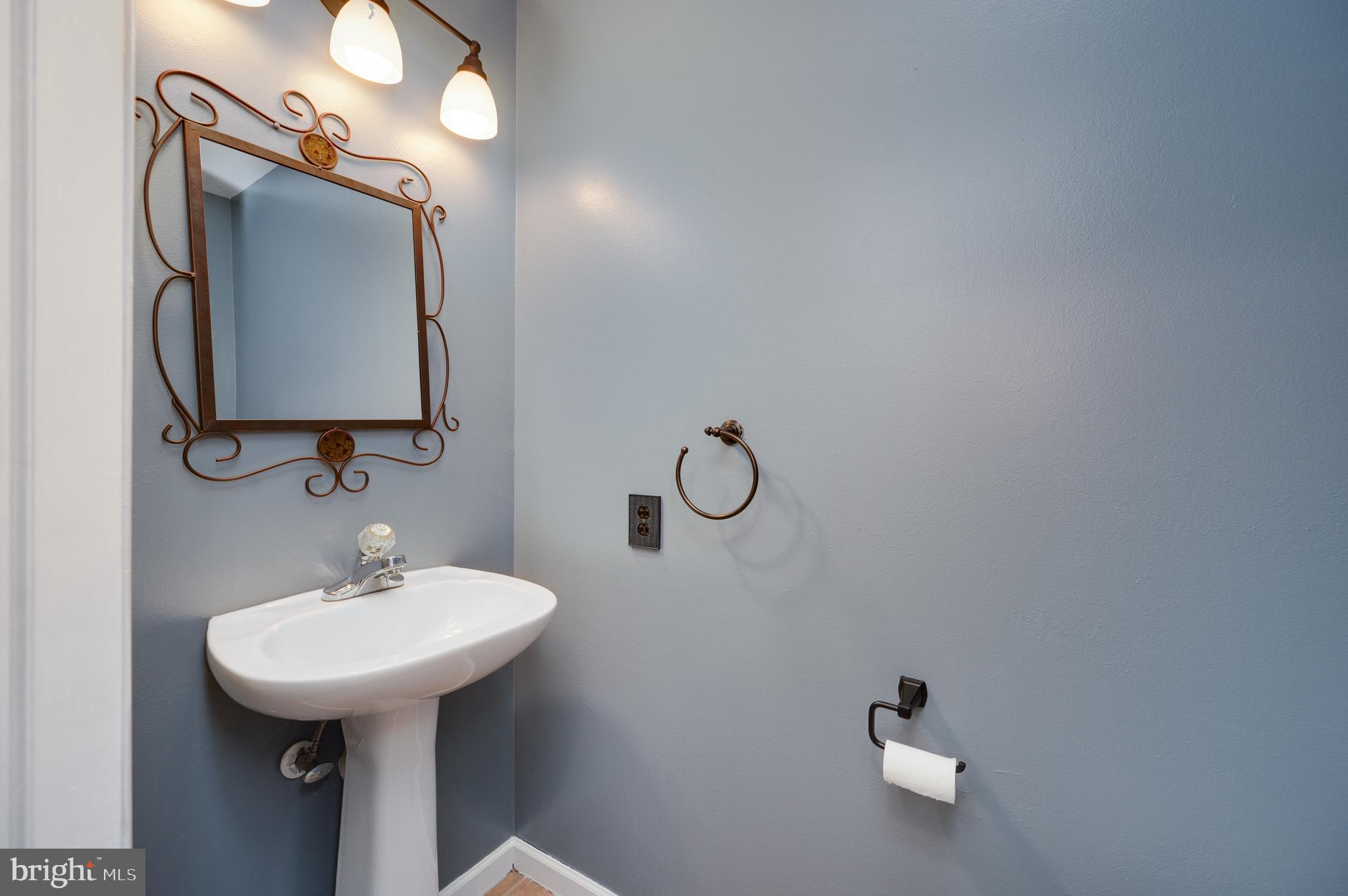 612 Frederick Street Reading, PA 19608 - Photo 15 of 33 a bathroom with a sink and mirror