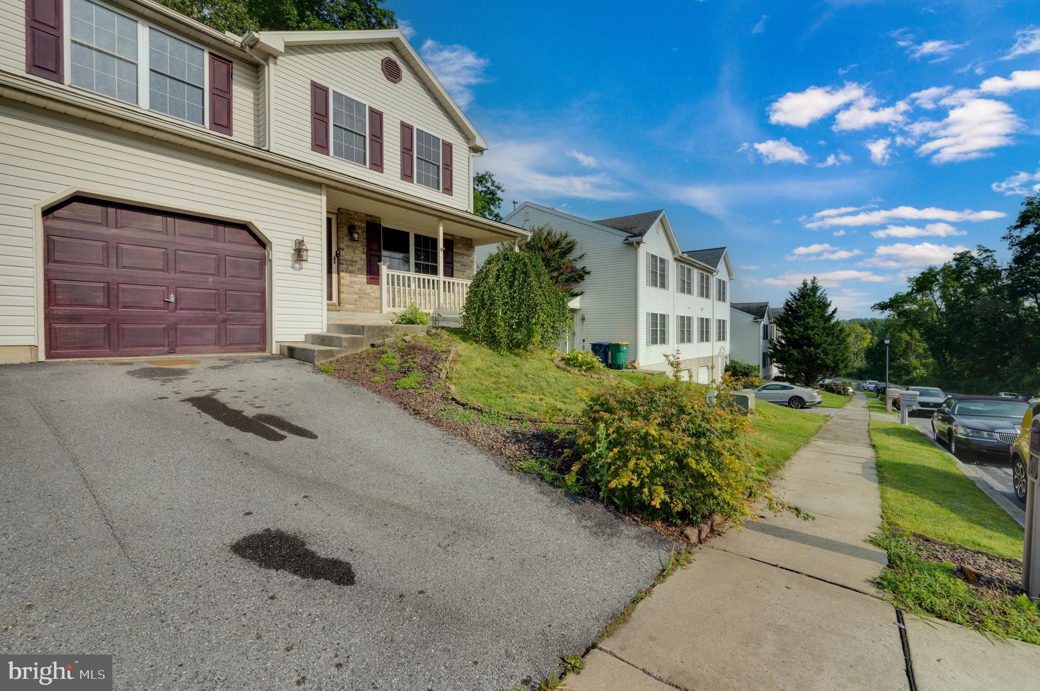 612 Frederick Street Reading, PA 19608 - Photo 2 of 33 front view of a house with a garden