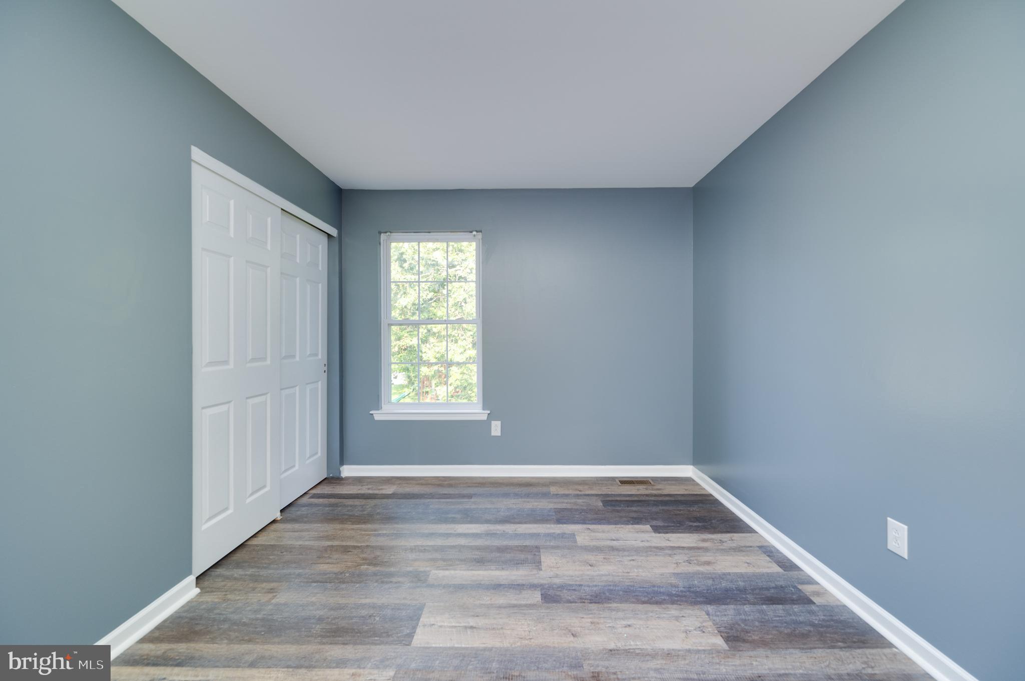 612 Frederick Street Reading, PA 19608 - Photo 21 of 33 a view of an empty room with wooden floor and a window