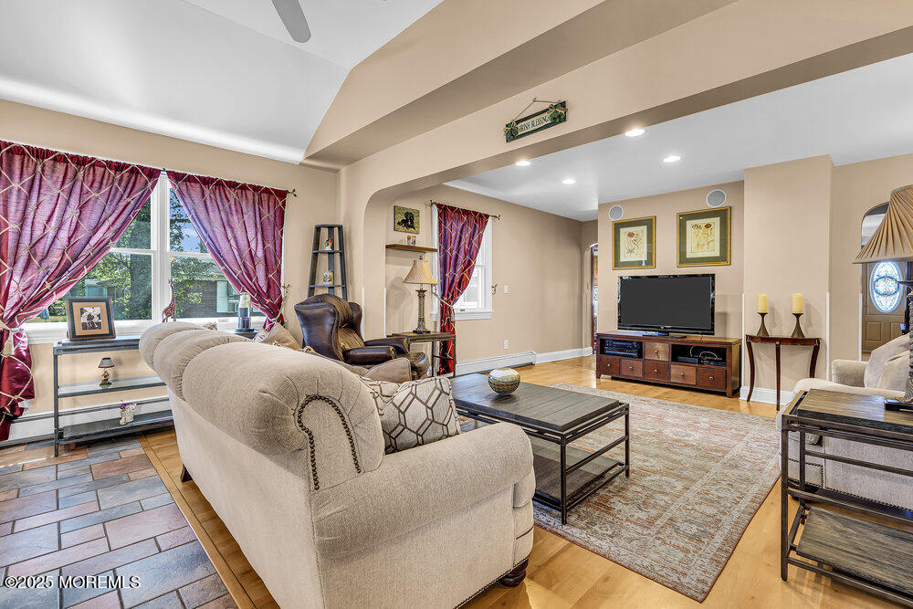 87 Amwell Road Hillsborough, NJ 08844 - Photo 13 of 46 a living room with furniture and a flat screen tv