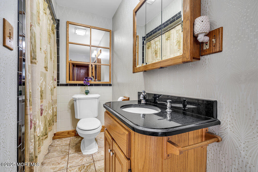 87 Amwell Road Hillsborough, NJ 08844 - Photo 18 of 46 a bathroom with a sink and a toilet