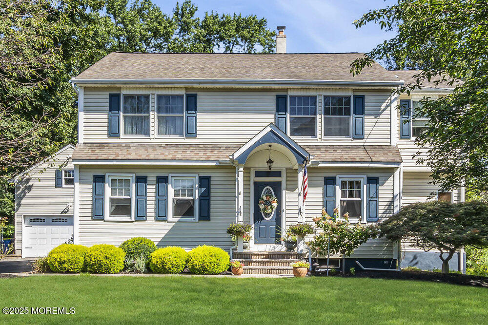 87 Amwell Road Hillsborough, NJ 08844 - Photo 2 of 46 a front view of a house with a yard and porch