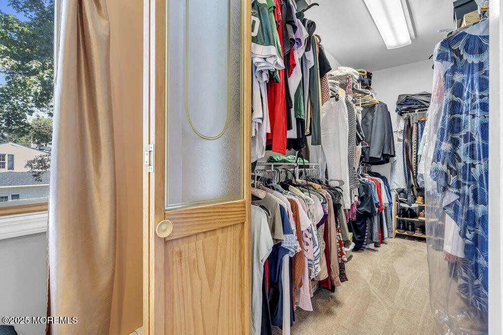 87 Amwell Road Hillsborough, NJ 08844 - Photo 21 of 46 a view of walk in closet with clothes