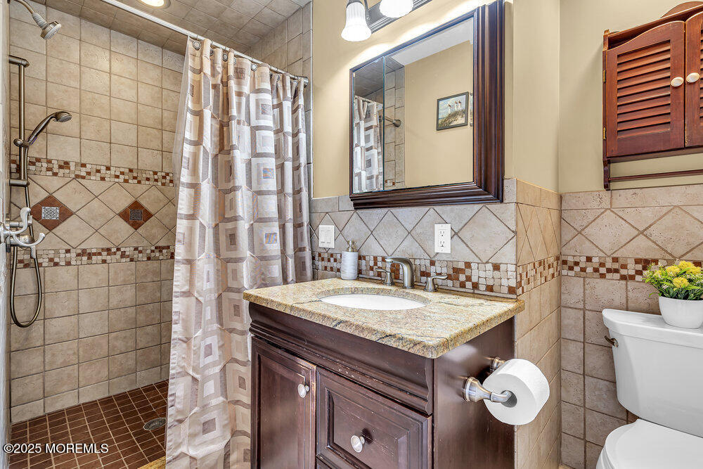 87 Amwell Road Hillsborough, NJ 08844 - Photo 22 of 46 a bathroom with a sink a toilet and a mirror