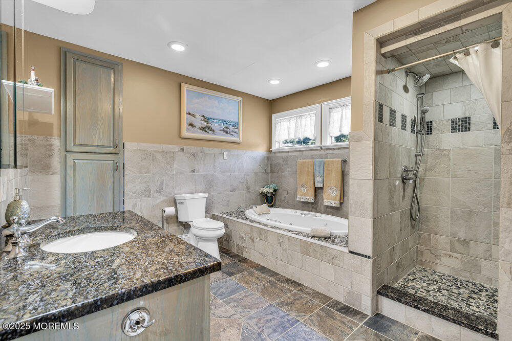 87 Amwell Road Hillsborough, NJ 08844 - Photo 23 of 46 a bathroom with a double vanity sink mirror and shower
