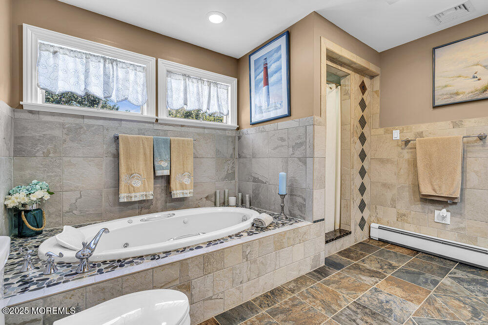 87 Amwell Road Hillsborough, NJ 08844 - Photo 25 of 46 a spacious bathroom with a granite countertop tub and a window