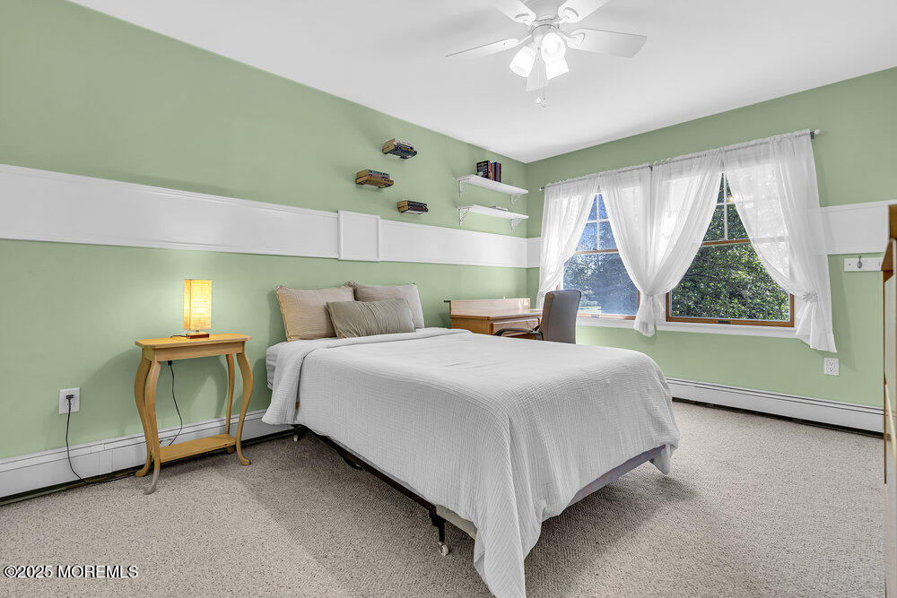 87 Amwell Road Hillsborough, NJ 08844 - Photo 27 of 46 a bedroom with a bed and a large window