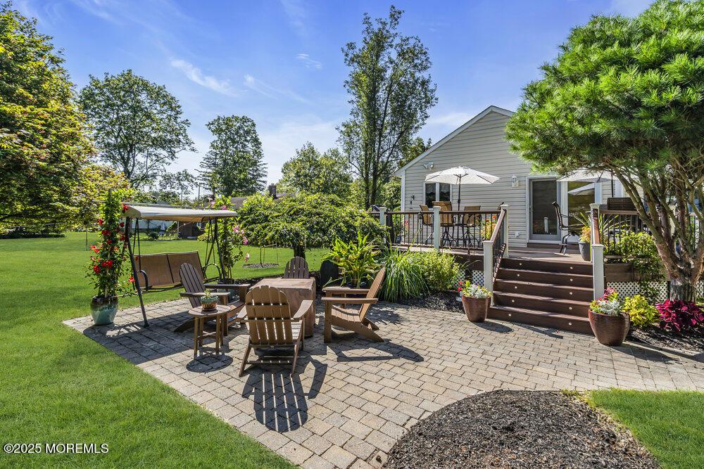 87 Amwell Road Hillsborough, NJ 08844 - Photo 33 of 46 a view of a chairs and table in backyard of the house