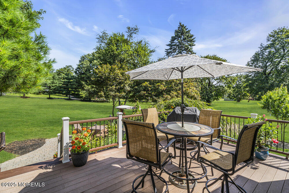 87 Amwell Road Hillsborough, NJ 08844 - Photo 34 of 46 a view of a table and chairs on the deck