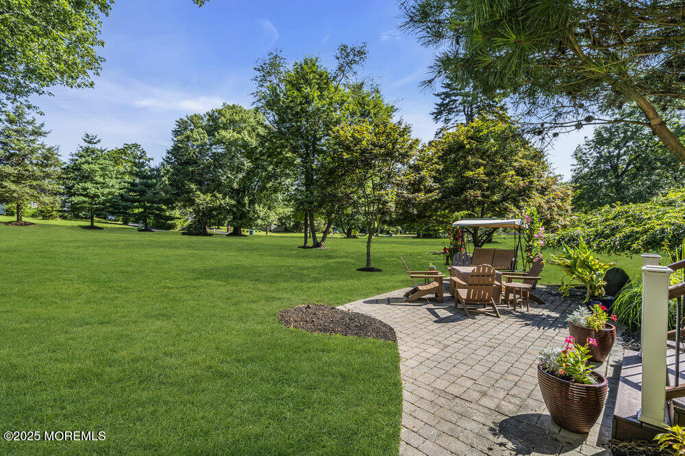87 Amwell Road Hillsborough, NJ 08844 - Photo 36 of 46 a view of a garden with an outdoor seating