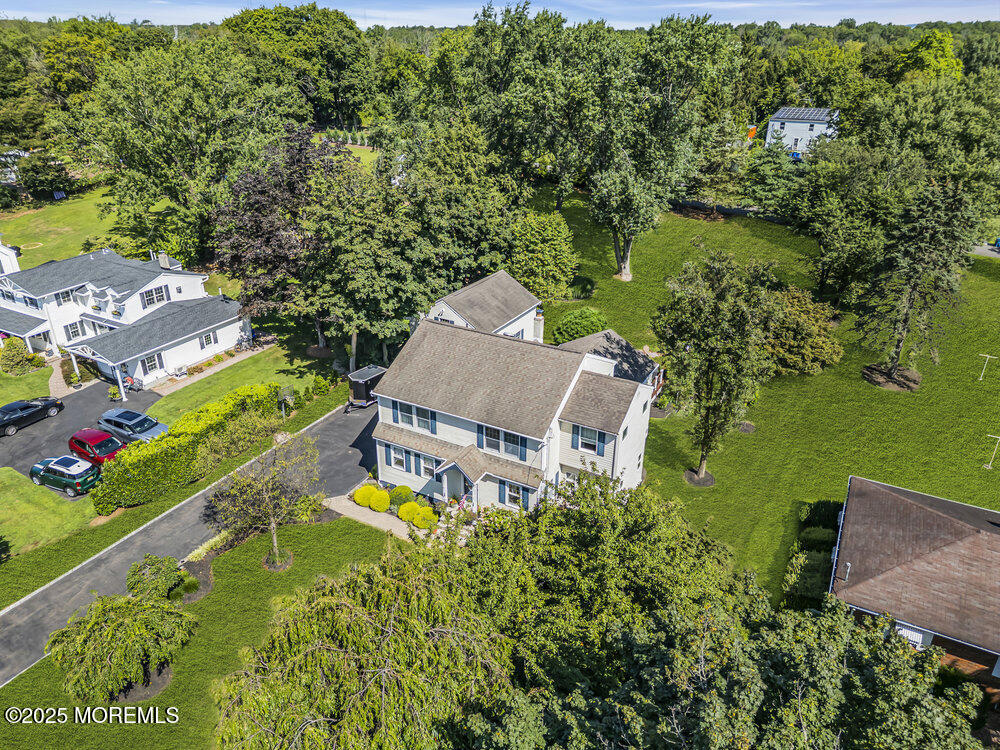 87 Amwell Road Hillsborough, NJ 08844 - Photo 42 of 46 an aerial view of a house with a garden and lake view