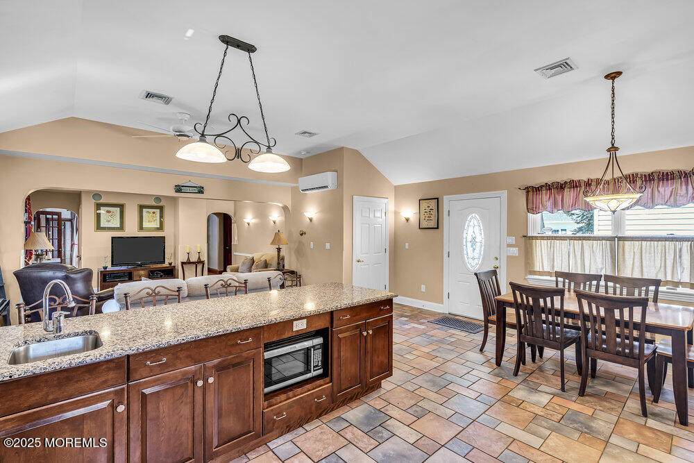 87 Amwell Road Hillsborough, NJ 08844 - Photo 8 of 46 a large kitchen with a table and chairs