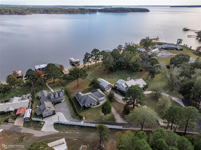 an aerial view of a house with a lake view