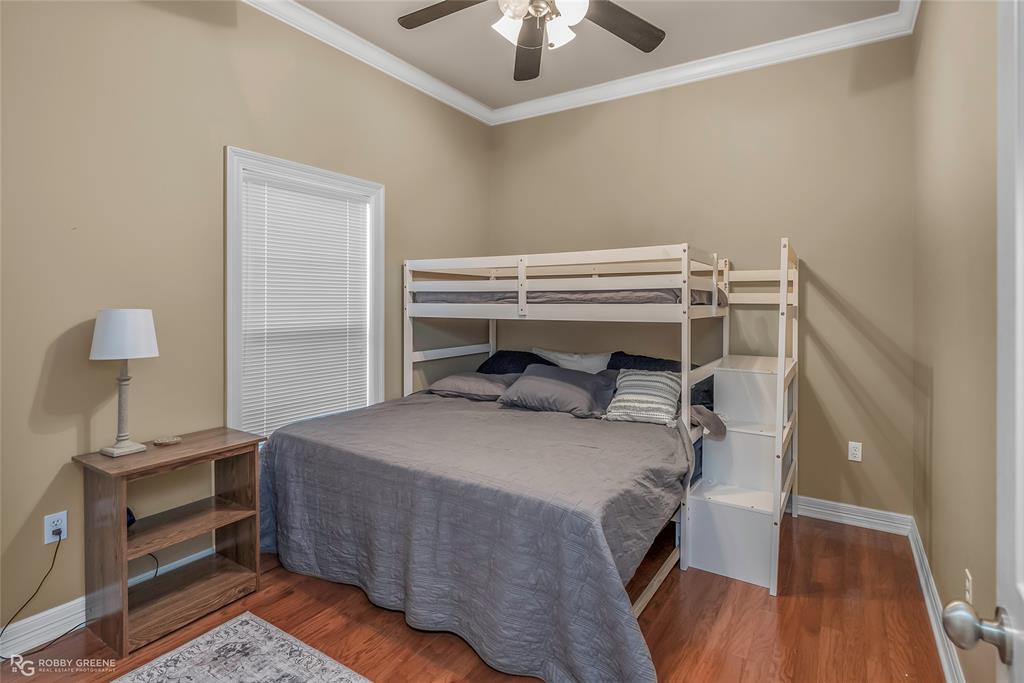 90 La Bella Court Many, LA 71449 - Photo 22 of 38 a bedroom with a bed and a chandelier