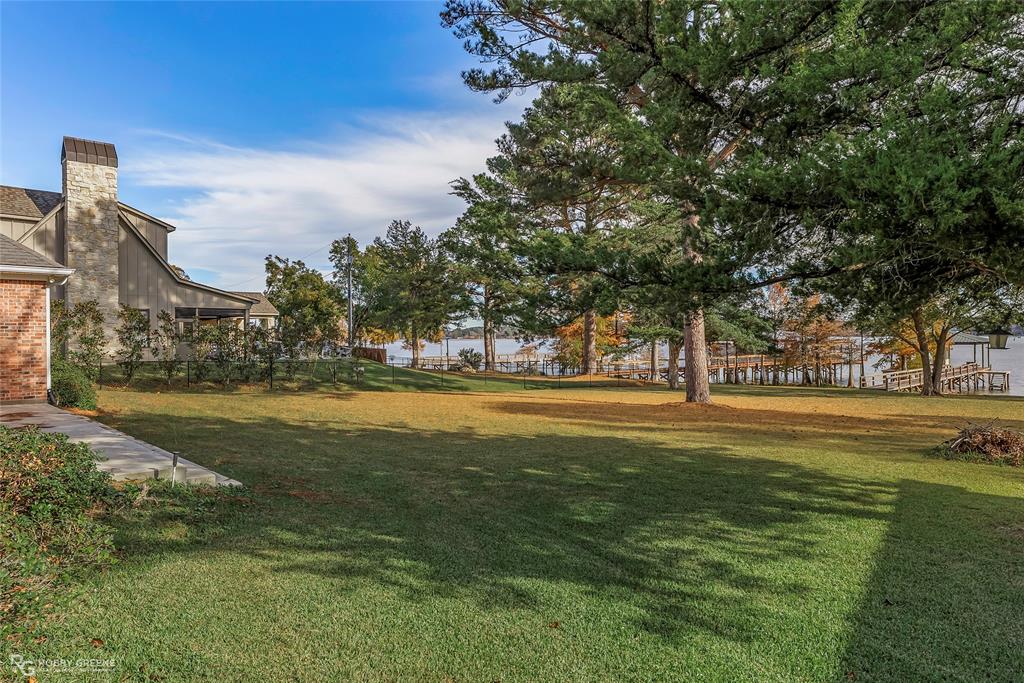 90 La Bella Court Many, LA 71449 - Photo 28 of 38 a swimming pool with outdoor seating and yard