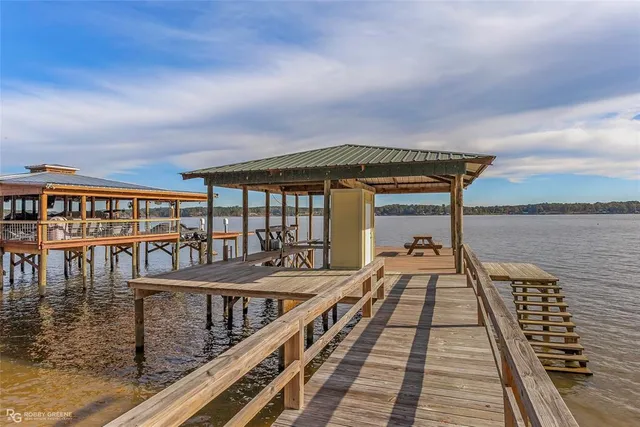 a view of a balcony with wooden floor and city view