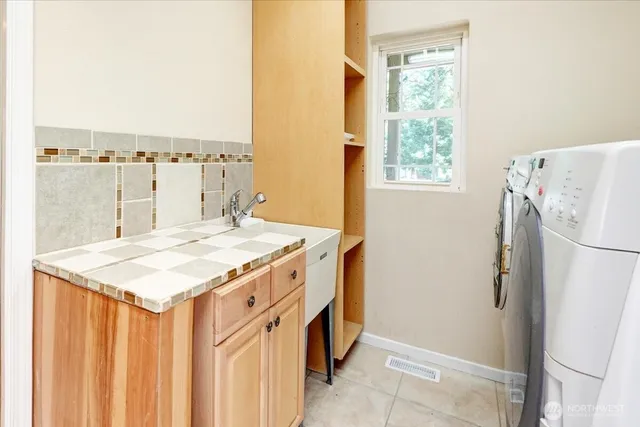a bathroom with a toilet and a shower curtain