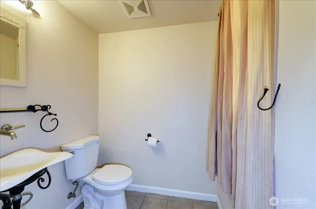 a view of staircase with white walls and windows