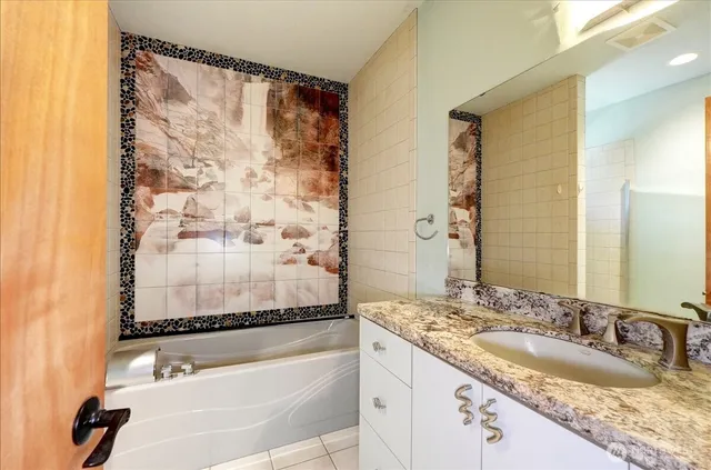 a bathroom with a window and a shower