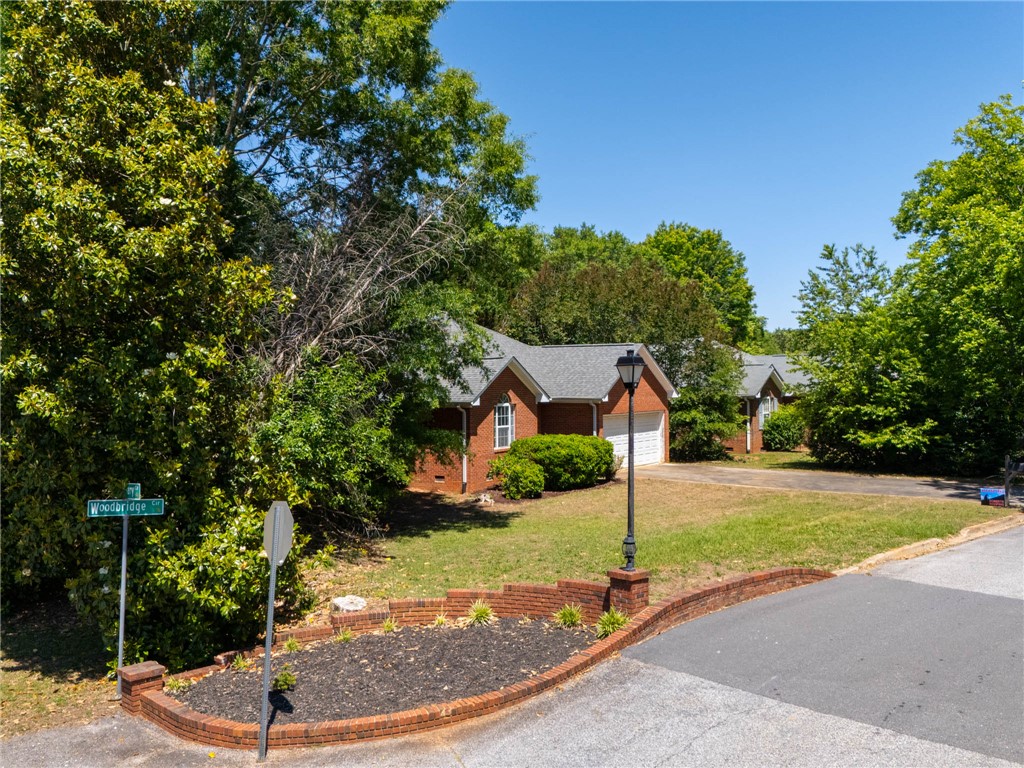 101 Woodbridge Circle Anderson, SC 29621 - Photo 19 of 21 This charming residence features a classic brick exterior and a well-maintained driveway.