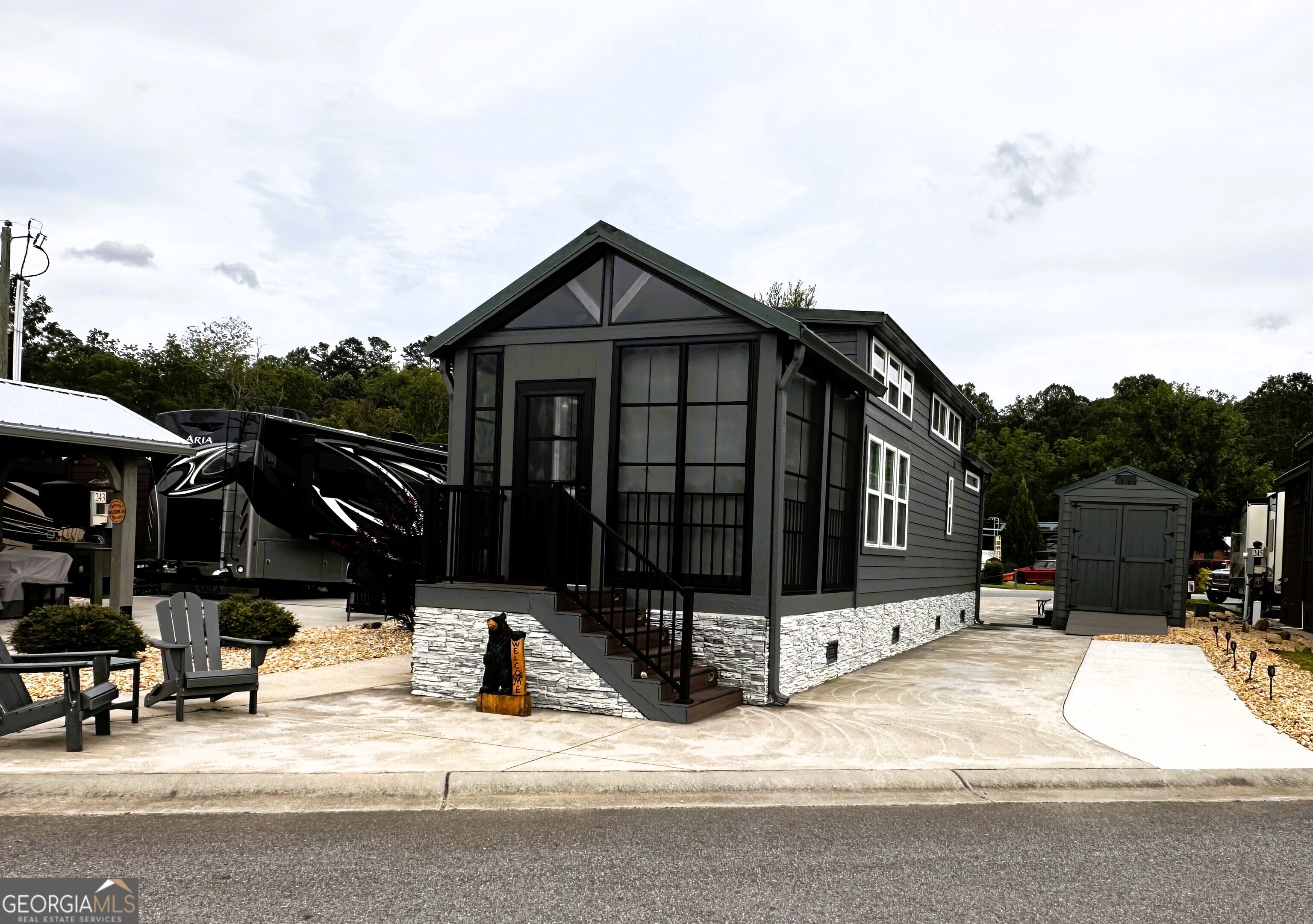 a view of a house with wooden fence