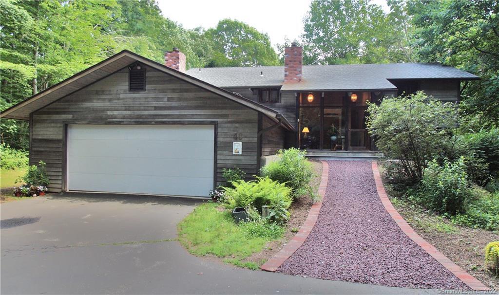 46 Woodland Road Deep River, CT 06417 - Photo 1 of 1 a front view of a house with garden