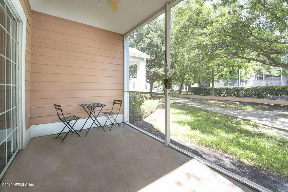 8550 Touchton Road, Unit 218 Jacksonville, FL 32216 - Photo 15 of 29 a view of a porch with chairs and backyard