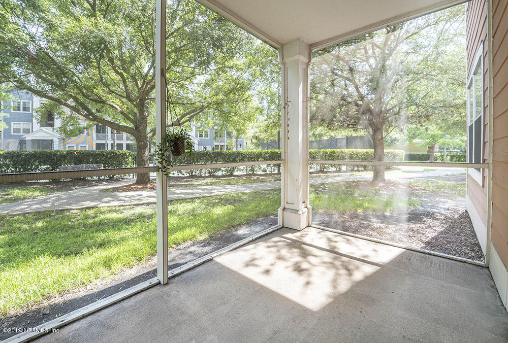 8550 Touchton Road, Unit 218 Jacksonville, FL 32216 - Photo 16 of 29 a view of a room with yard from a living room