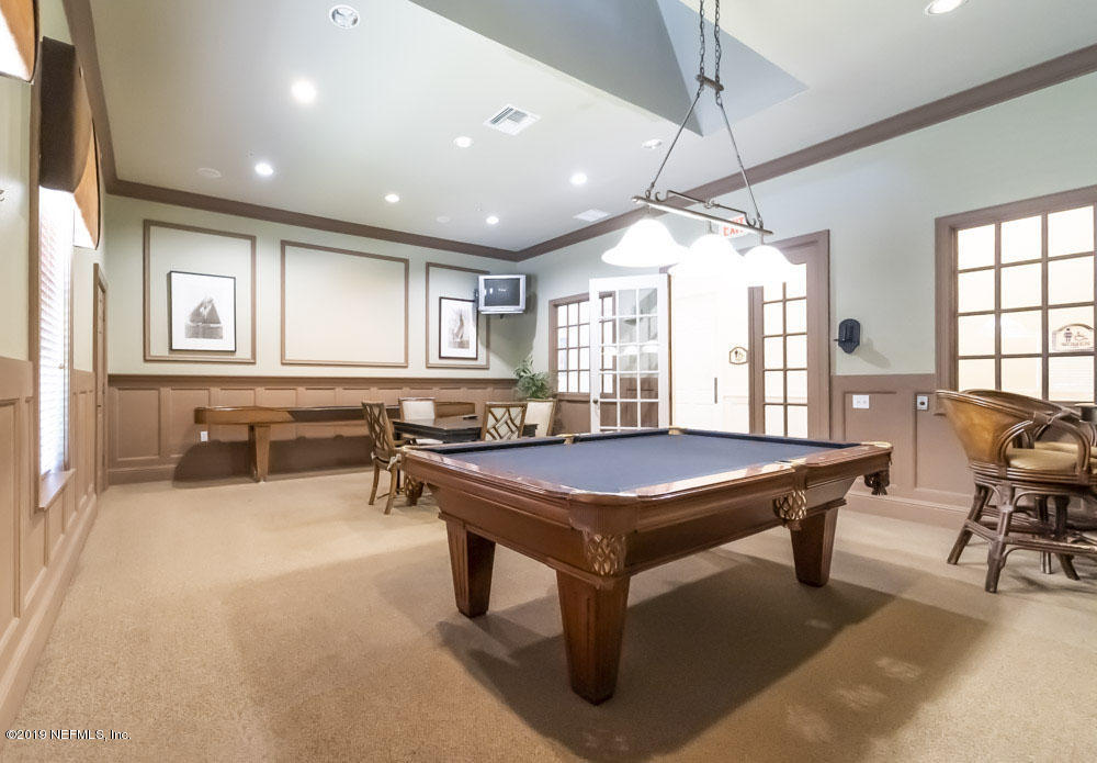 8550 Touchton Road, Unit 218 Jacksonville, FL 32216 - Photo 20 of 29 a room with furniture pool table and windows