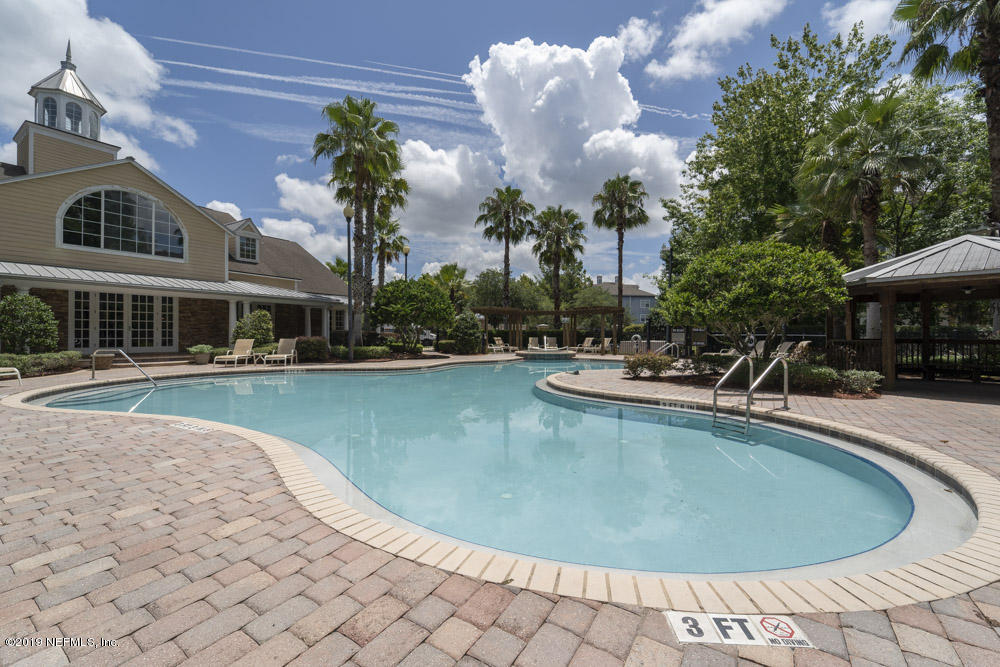 8550 Touchton Road, Unit 218 Jacksonville, FL 32216 - Photo 22 of 29 a view of a swimming pool with outdoor seating