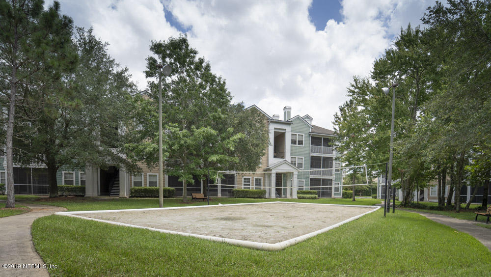 8550 Touchton Road, Unit 218 Jacksonville, FL 32216 - Photo 28 of 29 a view of a house with a yard