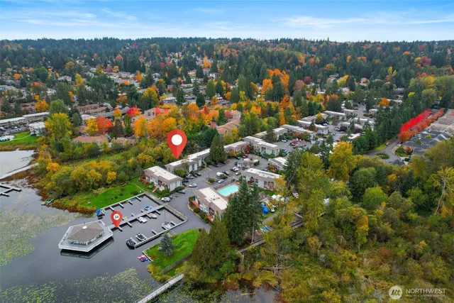 a view of swimming pool with outdoor seating and yard in the back